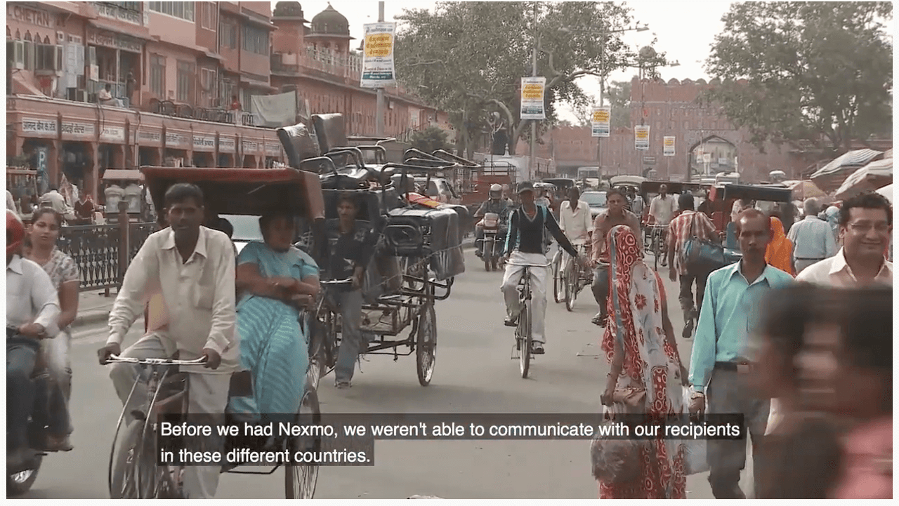 Remitly Video Case Study People in India riding bikes and carts on the street
