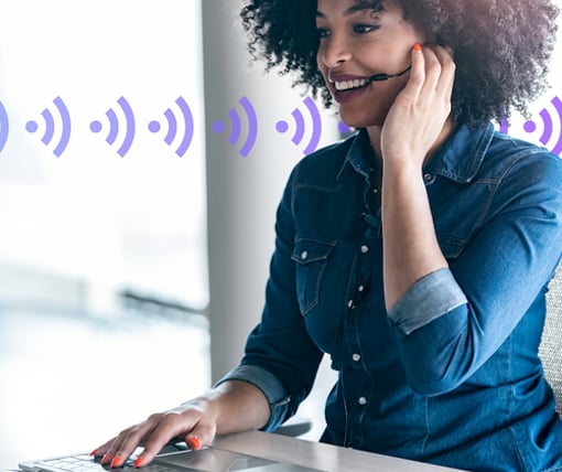 Stock image of woman on a headset and laptop